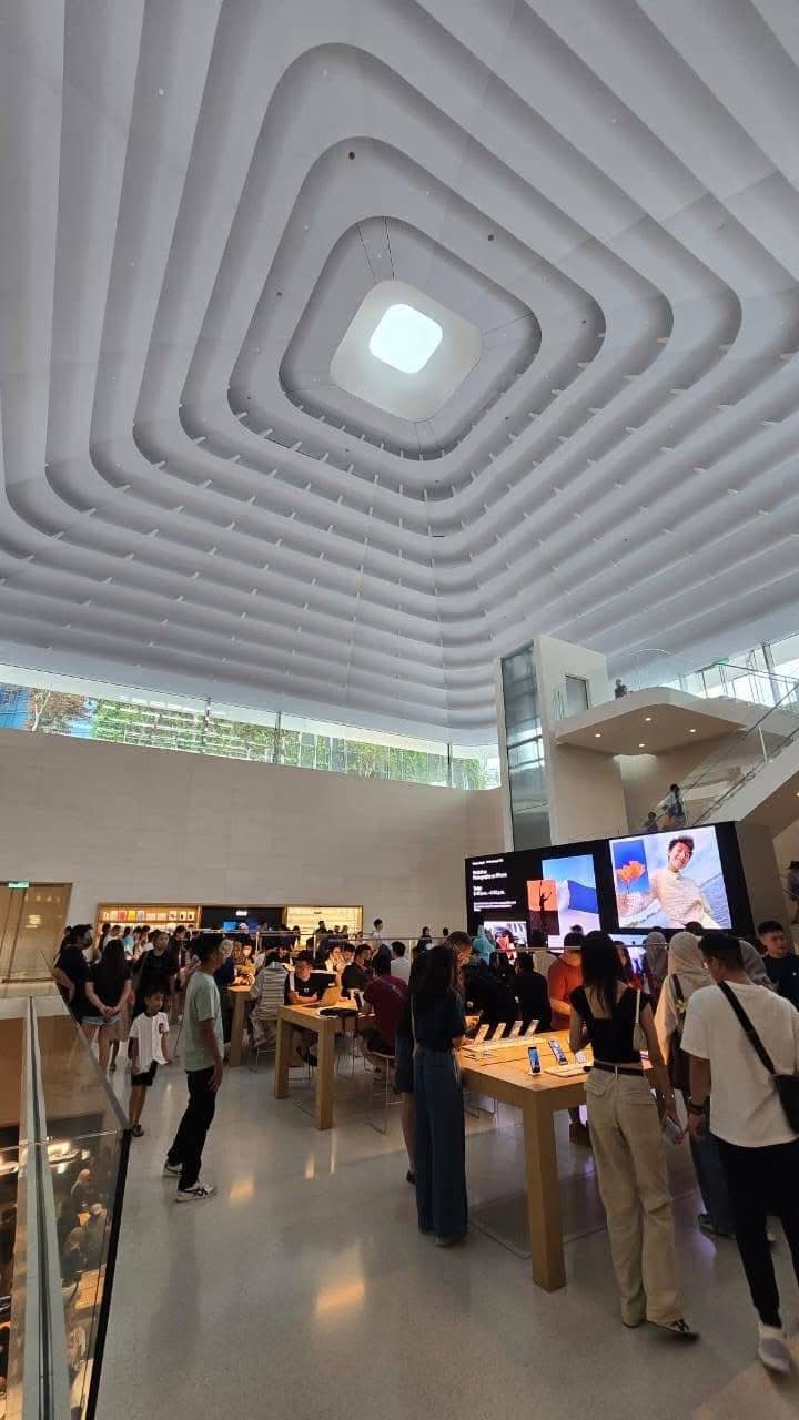 Stepped white ceiling rising to a square skylight above the upper sales floor